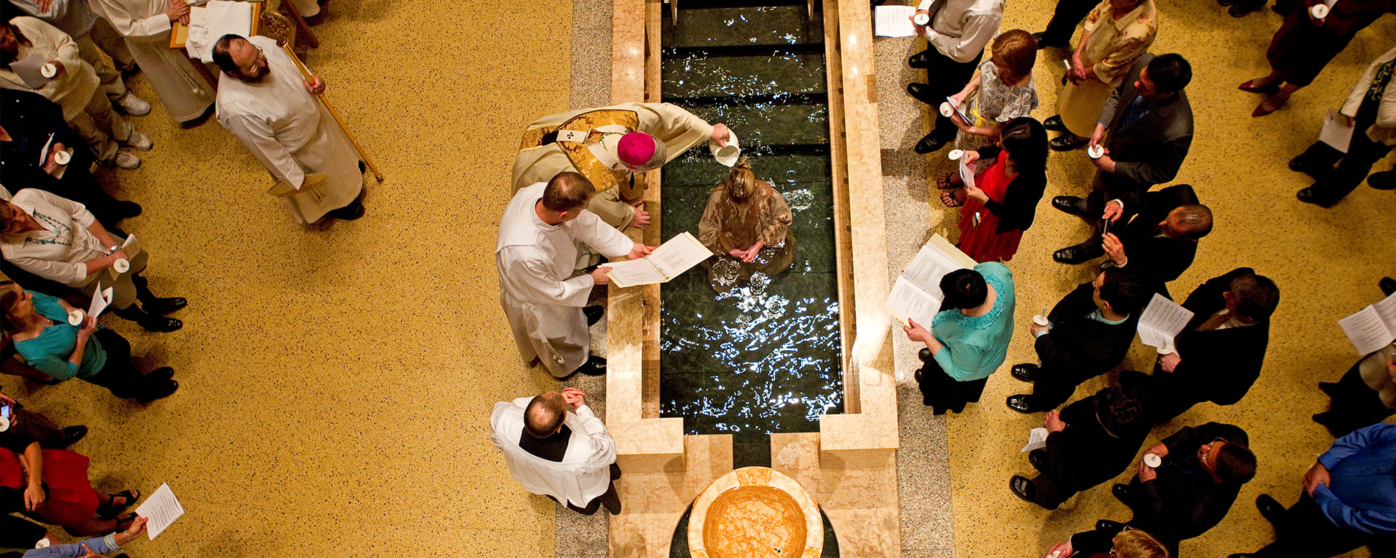 priest conducting a baptism