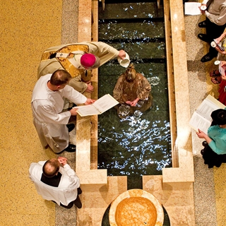 priest conducting a baptism