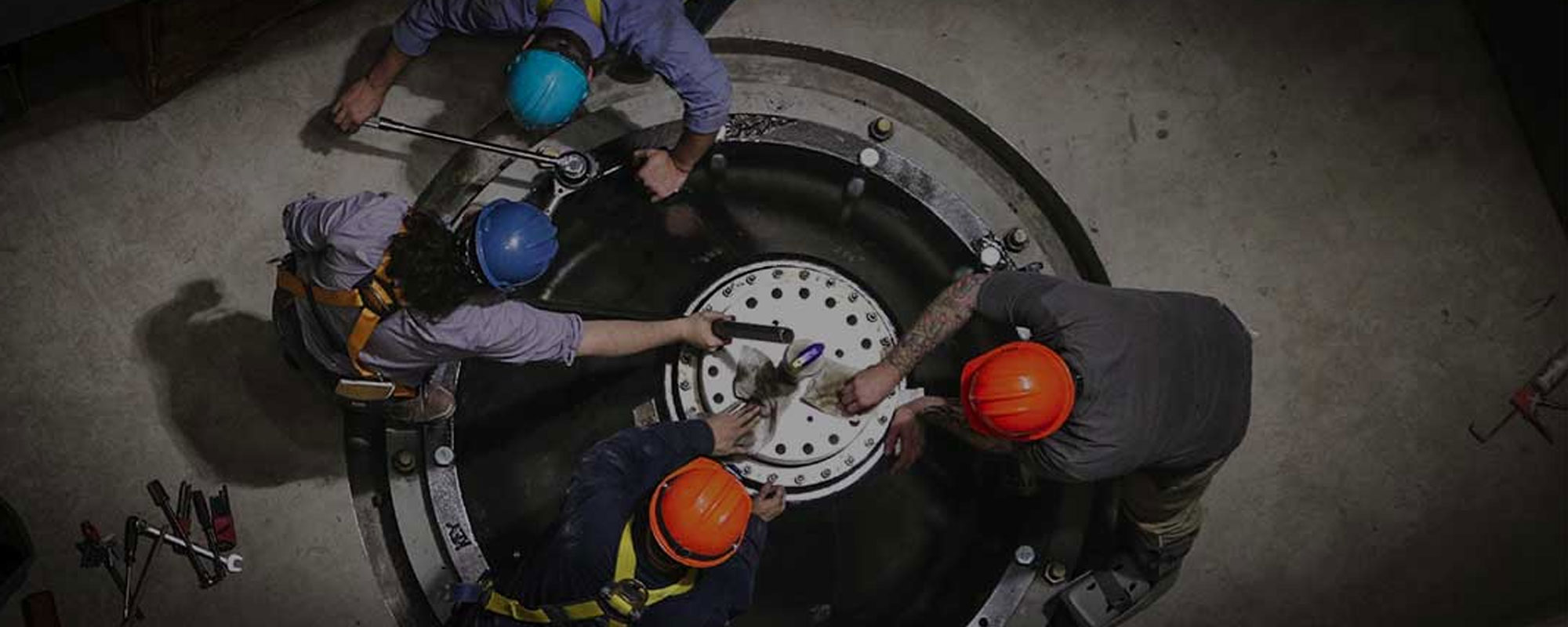 three men working on equipment