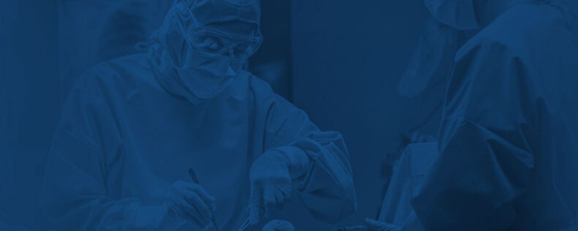 two people performing surgery with the image tinted blue