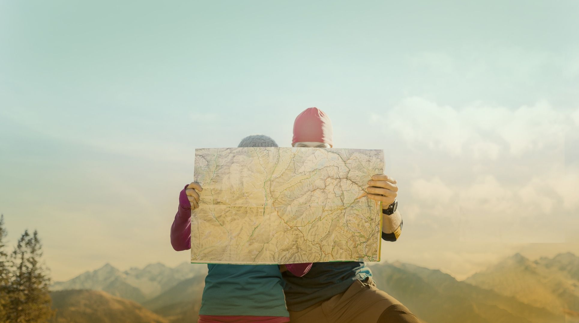 two hikers looking at a map