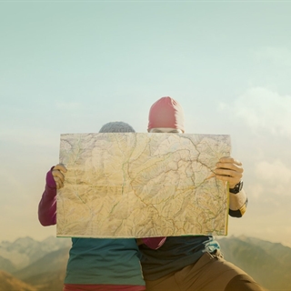 Hiker couple looking at a map