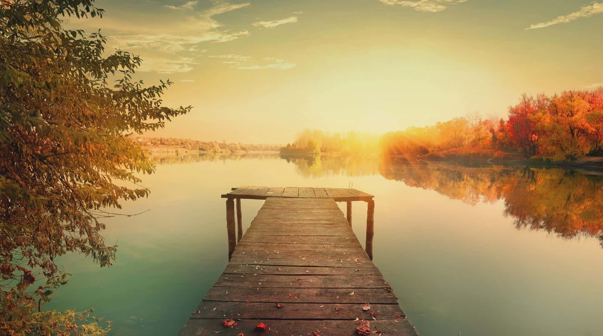 empty lake pier at sunrise