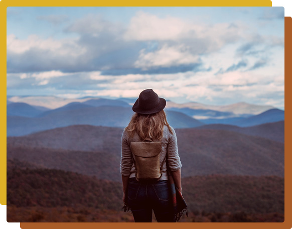 A female hiker looking out over mountains