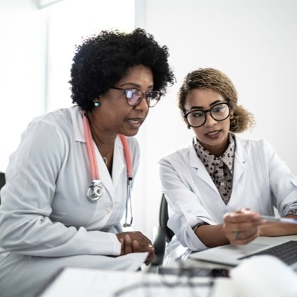 Researchers in white coats