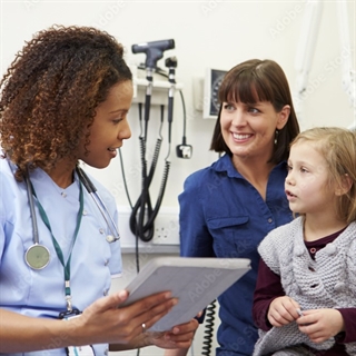 nurse talking to a parent and child