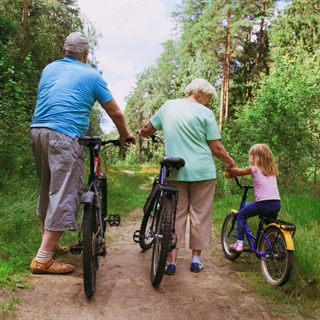 older couple and child with bikes