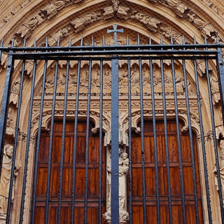 front of a church with a closed gate